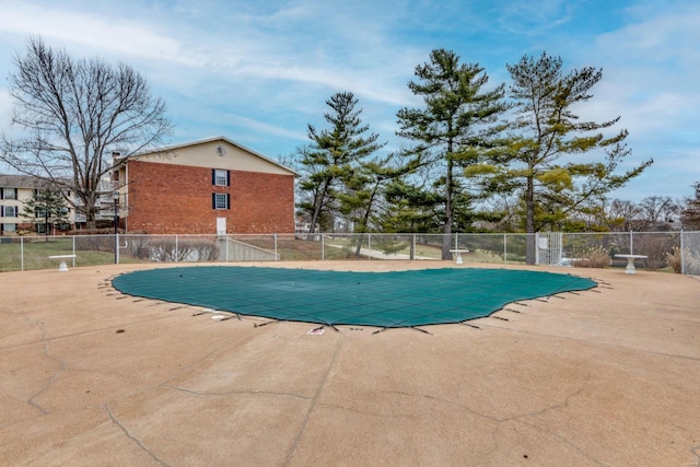 pool featuring a patio and fence