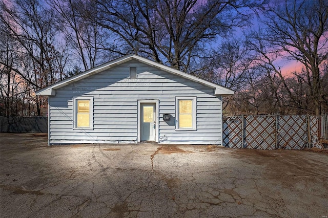 view of front of house featuring fence