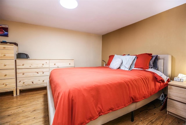 bedroom with wood finished floors