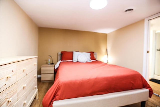 bedroom featuring dark wood finished floors