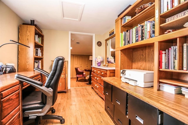 office area with attic access and light wood finished floors