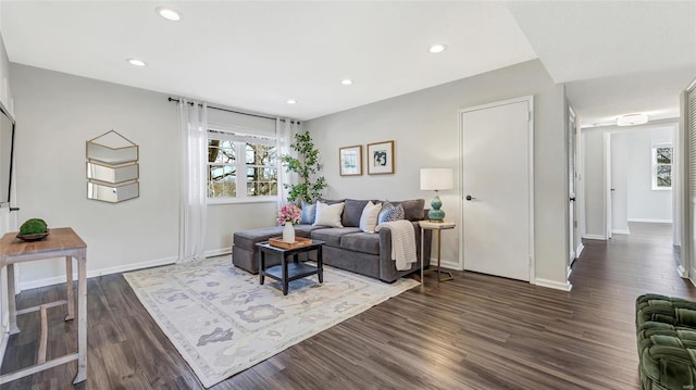 living room with baseboards, dark wood finished floors, and recessed lighting