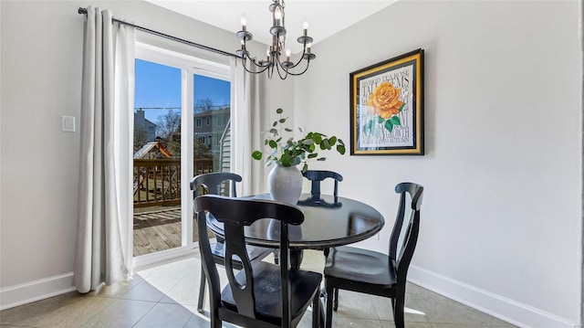 dining space with an inviting chandelier, baseboards, and light tile patterned flooring