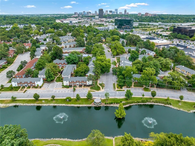 birds eye view of property with a water view and a city view