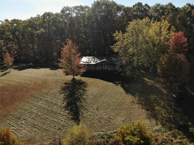 drone / aerial view with a view of trees