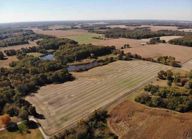 aerial view with a rural view and a water view