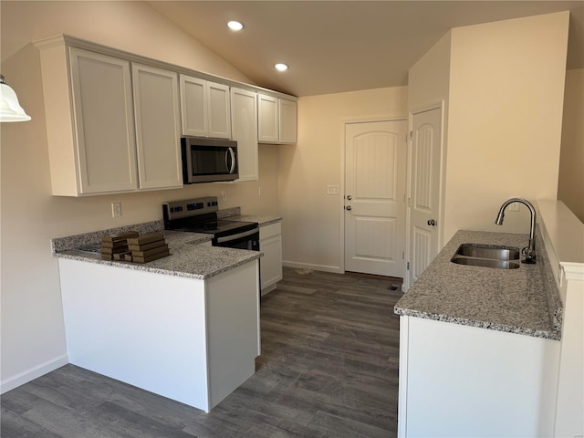 kitchen with stainless steel appliances, a sink, a peninsula, and light stone countertops