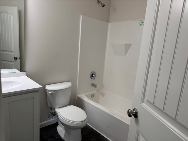 bathroom featuring toilet, shower / bathing tub combination, vanity, and baseboards