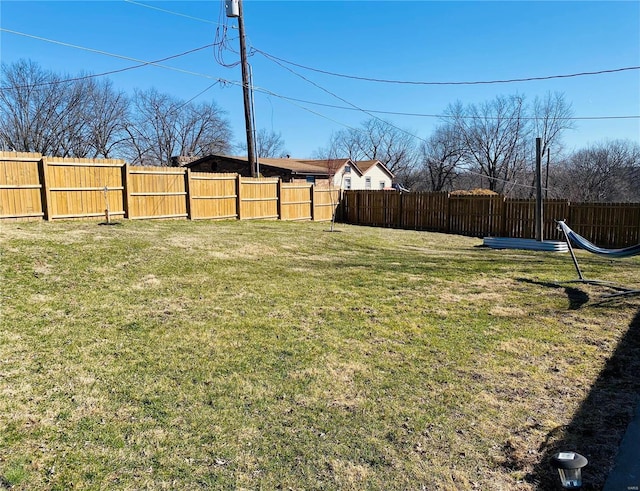 view of yard with a fenced backyard