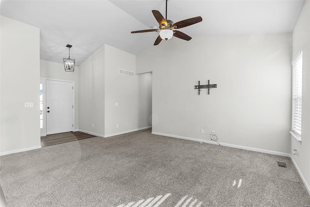 interior space featuring vaulted ceiling, visible vents, and baseboards