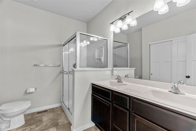 full bath featuring toilet, a stall shower, visible vents, and a sink