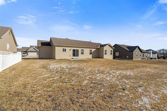 rear view of house with a patio area, fence, and a residential view