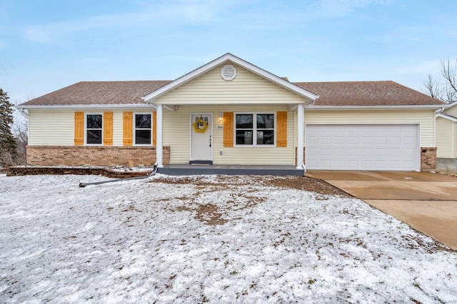 ranch-style home featuring driveway, a shingled roof, a garage, and brick siding