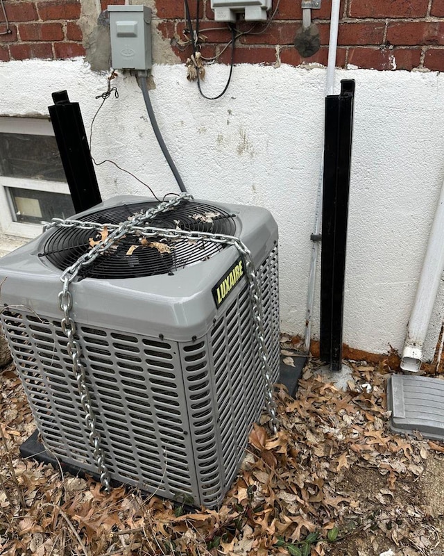 details with stucco siding and central air condition unit