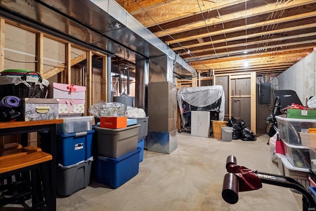unfinished basement featuring heating unit