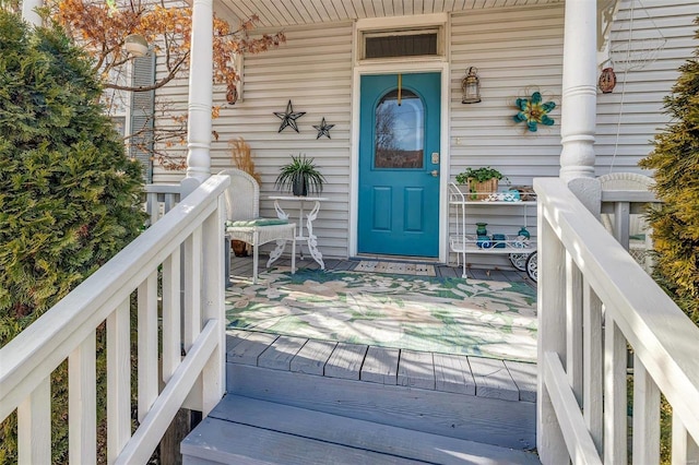 entrance to property featuring a porch