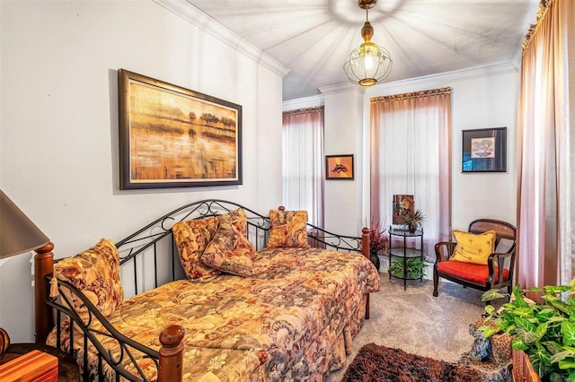 bedroom with carpet floors and crown molding