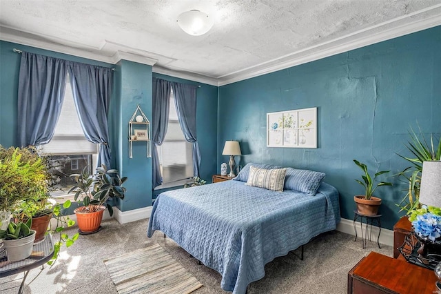 carpeted bedroom with a textured ceiling, baseboards, and crown molding