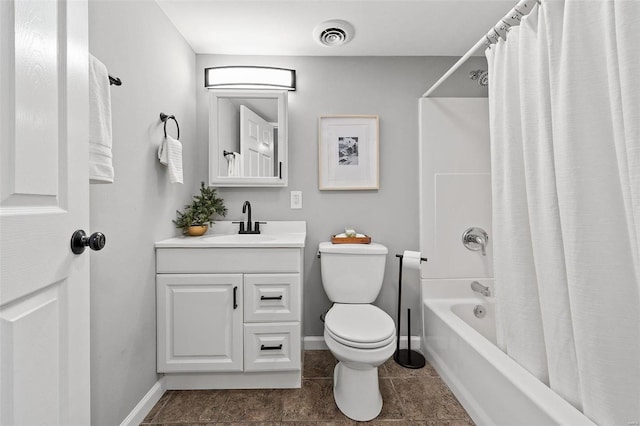 full bathroom with vanity, baseboards, visible vents, shower / tub combo, and toilet