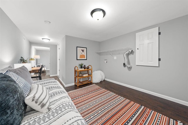 bedroom featuring baseboards and wood finished floors