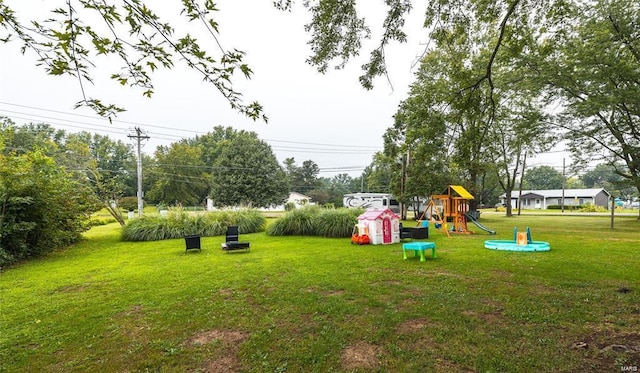 view of yard featuring playground community