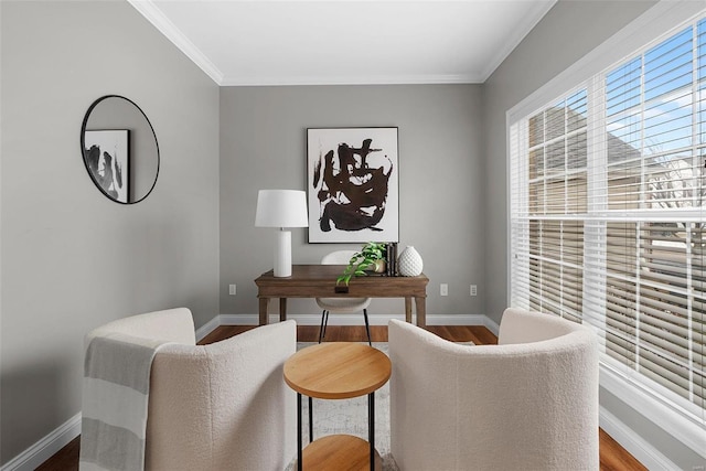 office area with ornamental molding, wood finished floors, and baseboards