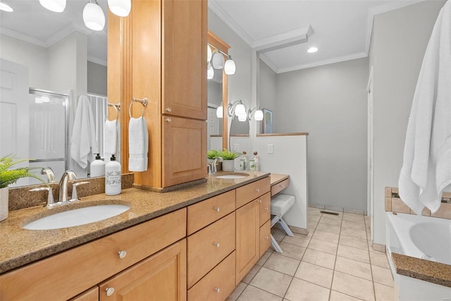 bathroom featuring tile patterned floors, a sink, and crown molding