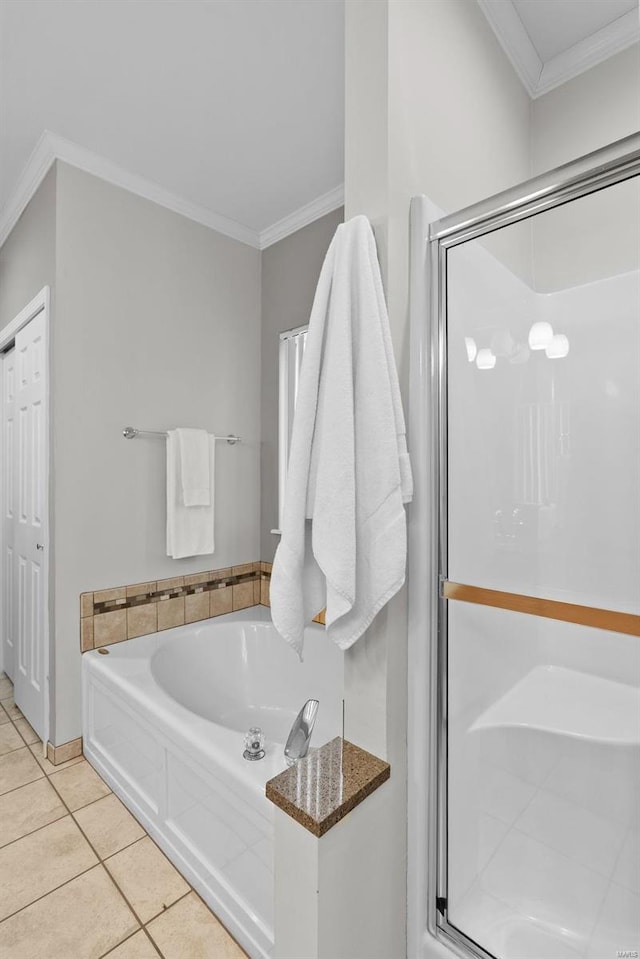 full bath featuring ornamental molding, a stall shower, a garden tub, and tile patterned floors