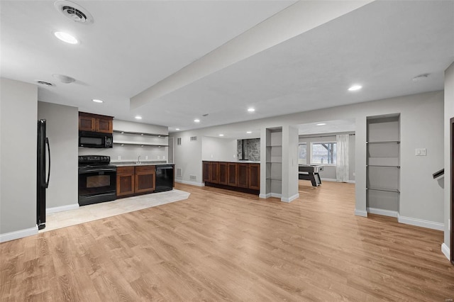 kitchen featuring open shelves, visible vents, baseboards, black appliances, and light wood finished floors