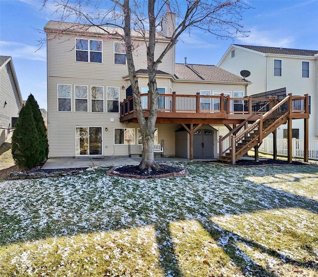 back of property featuring a deck, stairway, a patio area, and fence