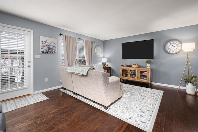 living room with wood finished floors and baseboards