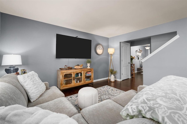 living room featuring baseboards and wood finished floors