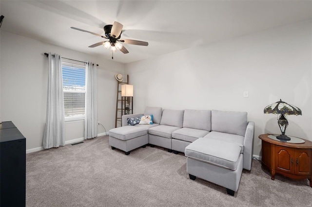 carpeted living room with ceiling fan, visible vents, and baseboards