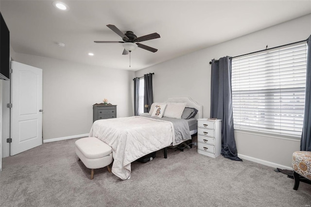 carpeted bedroom with ceiling fan, baseboards, and recessed lighting