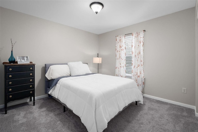 bedroom with carpet flooring and baseboards