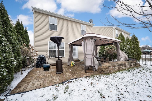 rear view of house featuring a patio area, fence, and a gazebo