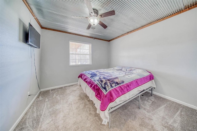 bedroom featuring crown molding, baseboards, carpet floors, and ceiling fan