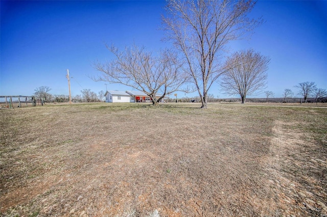 view of yard with a rural view