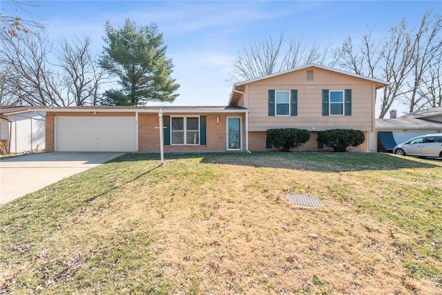 split level home featuring a front yard, brick siding, driveway, and an attached garage