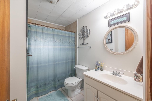 bathroom featuring toilet, tile patterned floors, a shower with shower curtain, and vanity