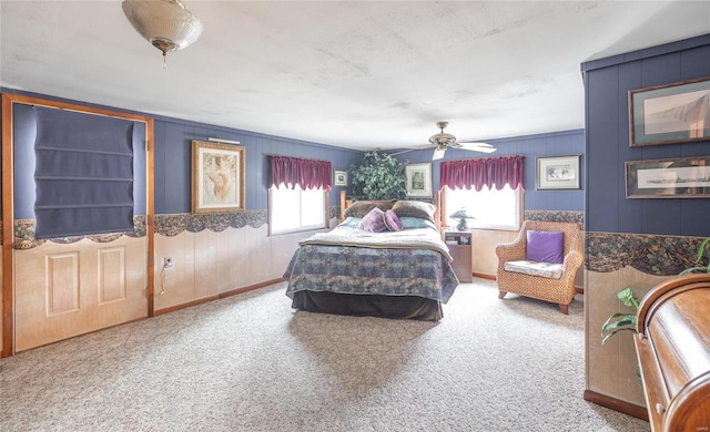 bedroom featuring a ceiling fan, carpet flooring, and baseboards