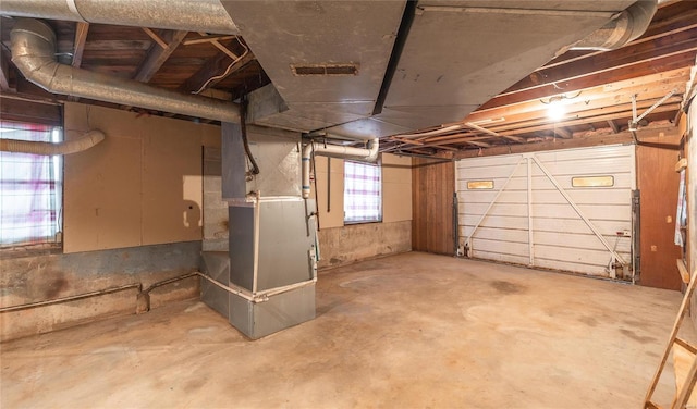 garage with visible vents and heating unit