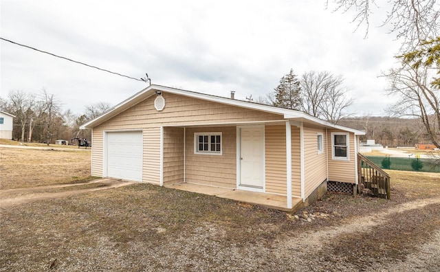 garage featuring driveway