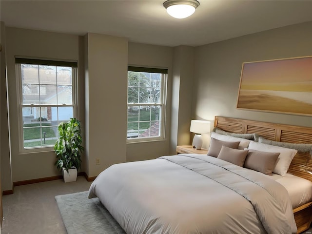 carpeted bedroom with baseboards