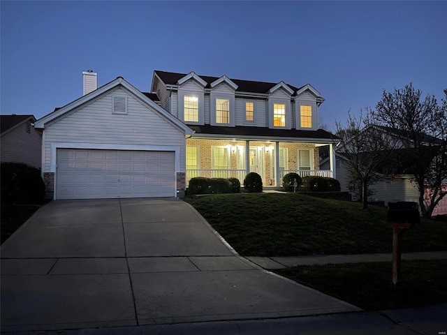 traditional-style home with a garage, covered porch, a front lawn, and concrete driveway