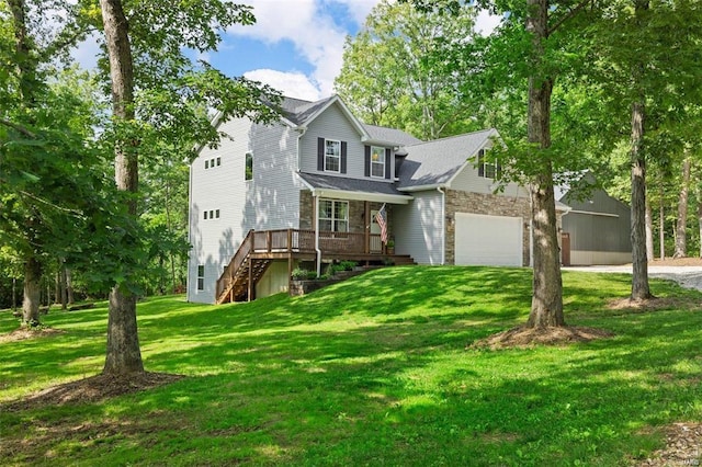 traditional home featuring a garage, stairs, stone siding, a wooden deck, and a front yard