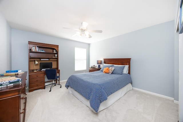 bedroom with carpet, a ceiling fan, and baseboards