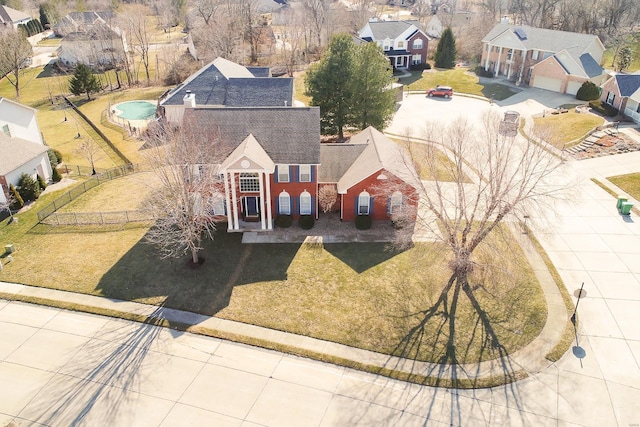 birds eye view of property with a residential view