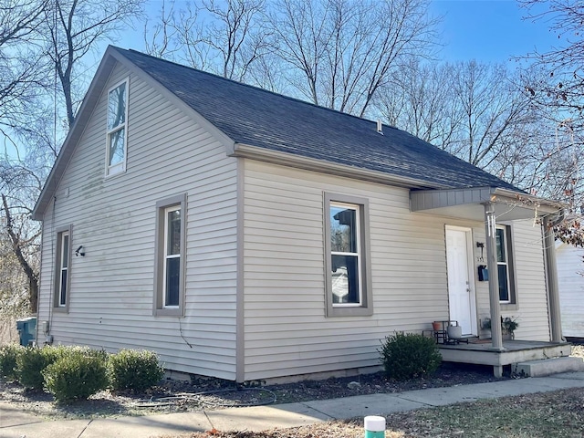 view of front of house featuring roof with shingles