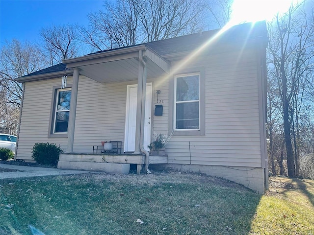 view of front of home with a front lawn and a porch